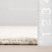 Arrel Wool Blend Rug in Alabaster with Speckled Design