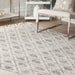 Geometrinen kuviollinen beige matto tupsuilla