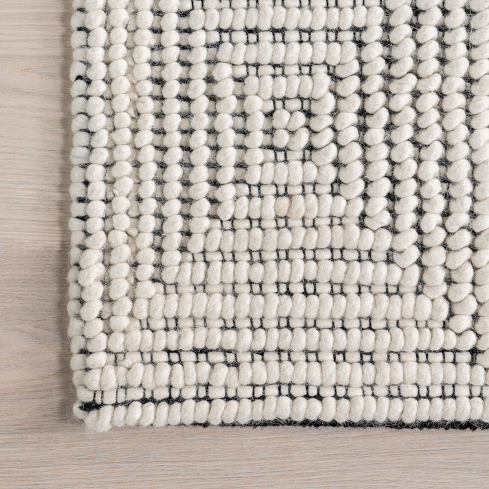 Handmade Ivory Wool Rug with High-Low Design