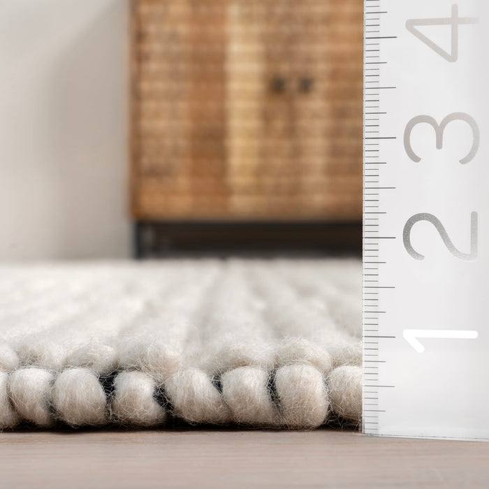 Handmade Ivory Wool Rug with High-Low Design