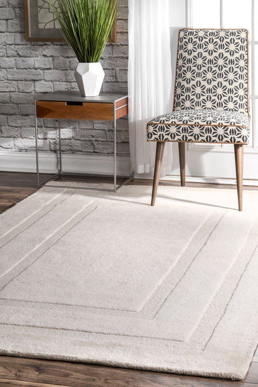 Ivory Wool Area Rug With Double Border Design