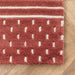 Mandia Wool Striped Area Rug in Brick Red