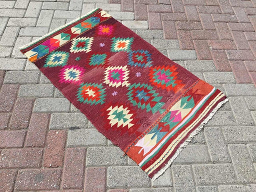 Tappeto vintage Kilim rosso 112 cm x 69 cm tessuto a mano dalla Turchia