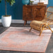 Serrated Emblem Area Rug in Rust Color