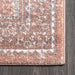 Serrated Emblem Area Rug in Rust Color