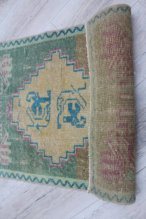 Vintage Turks handgeknoopt wollen vloerkleed 54 x 89 cm